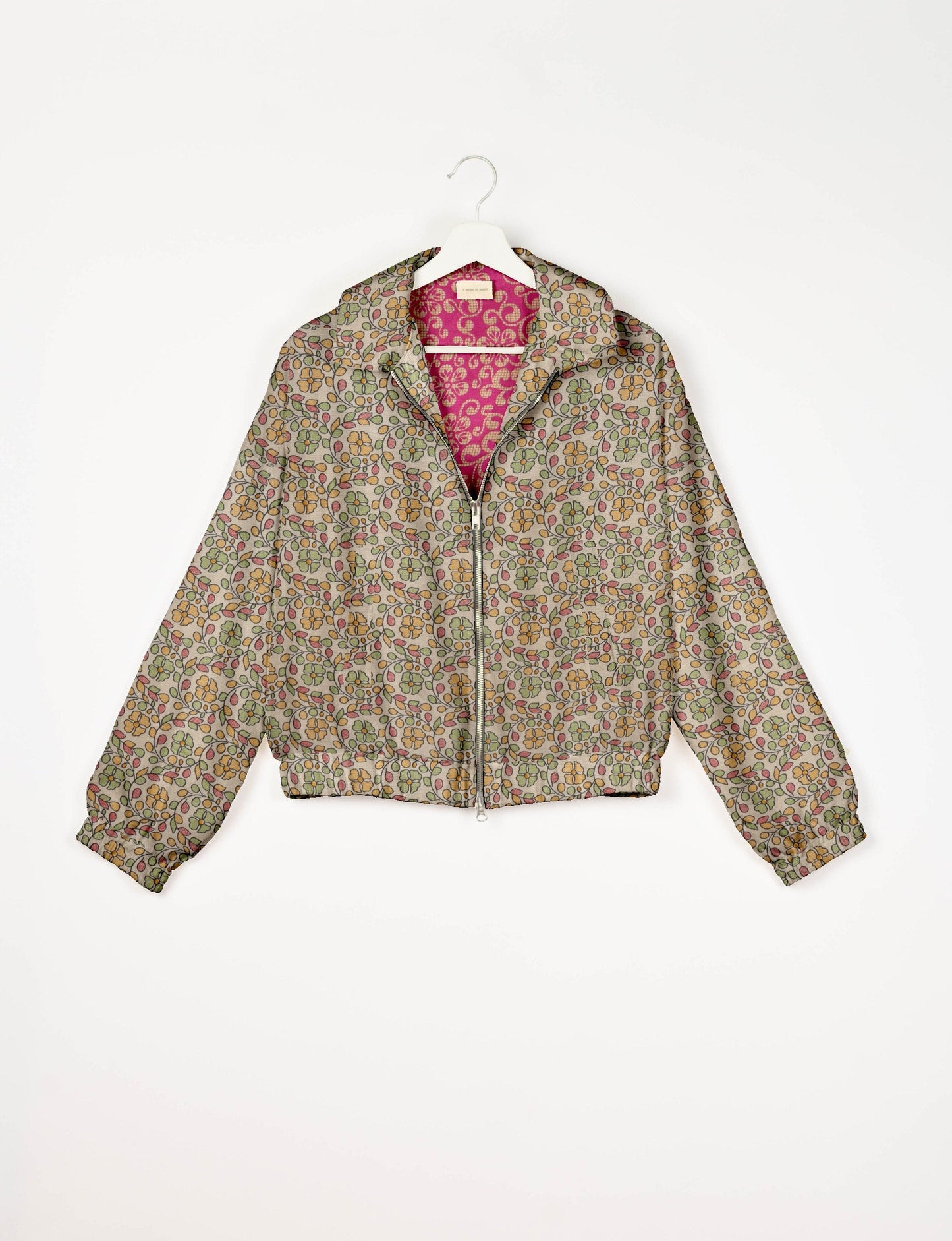Upcycled Bomber Jacket made from recycled sari materials, featuring a cute cropped shape, elasticated hem and cuffs, and contrast sari print lining. Sustainable apparel promoting eco-friendly fashion and ethical clothing.