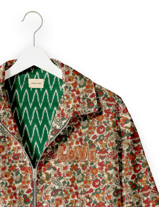Love Bomber Jacket made from recycled fabric, featuring hand-stitched Aari embroidery. A unique piece of zero-waste clothing, part of the circular fashion movement. Designed with upcycled materials for a stylish yet environmentally friendly clothing choice.