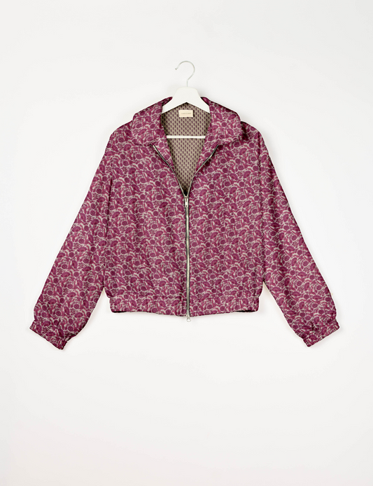 Upcycled Bomber Jacket made from recycled sari materials, featuring a cute cropped shape, elasticated hem and cuffs, and contrast sari print lining. Sustainable apparel promoting eco-friendly fashion and ethical clothing.