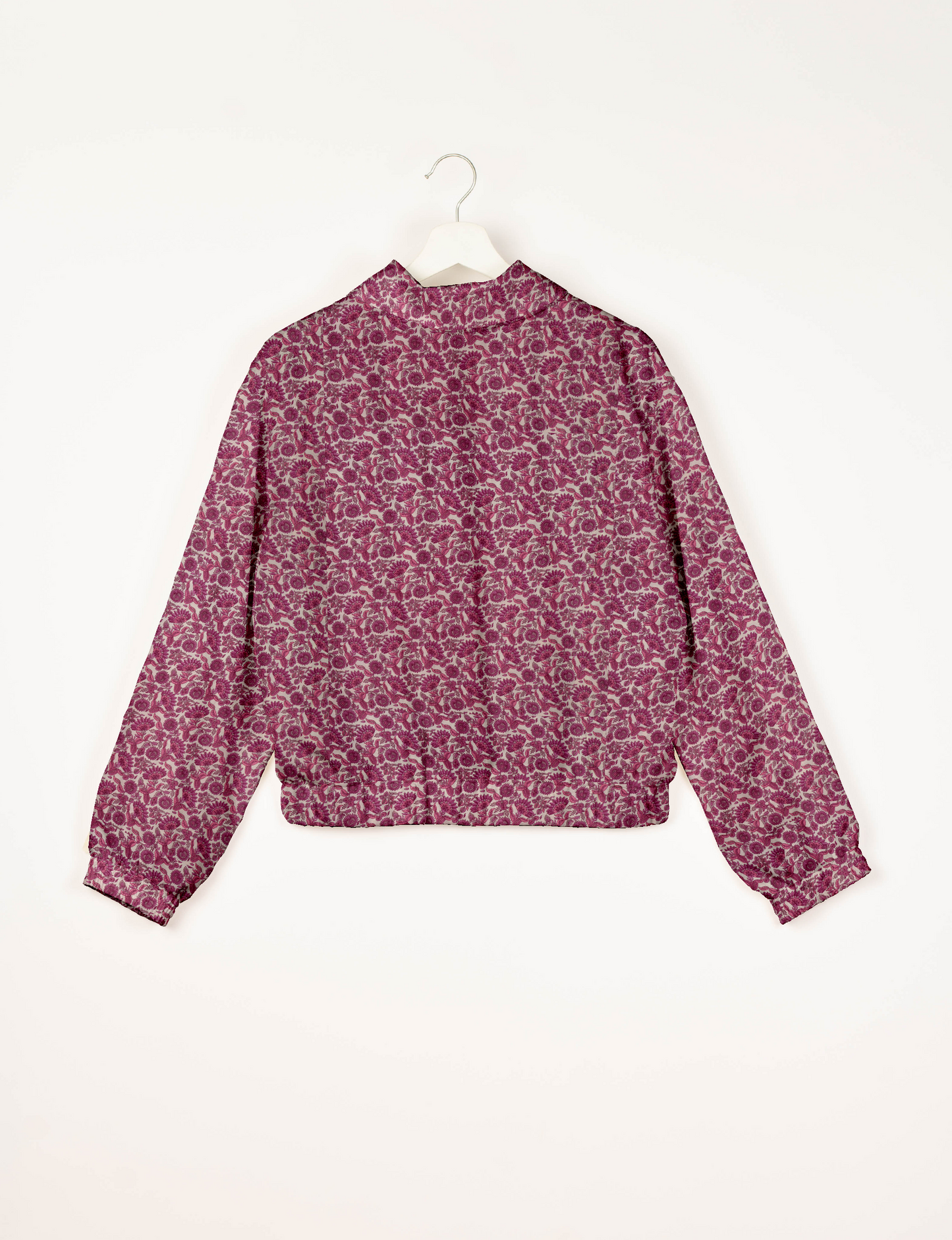 Upcycled Bomber Jacket made from recycled sari materials, featuring a cute cropped shape, elasticated hem and cuffs, and contrast sari print lining. Sustainable apparel promoting eco-friendly fashion and ethical clothing.