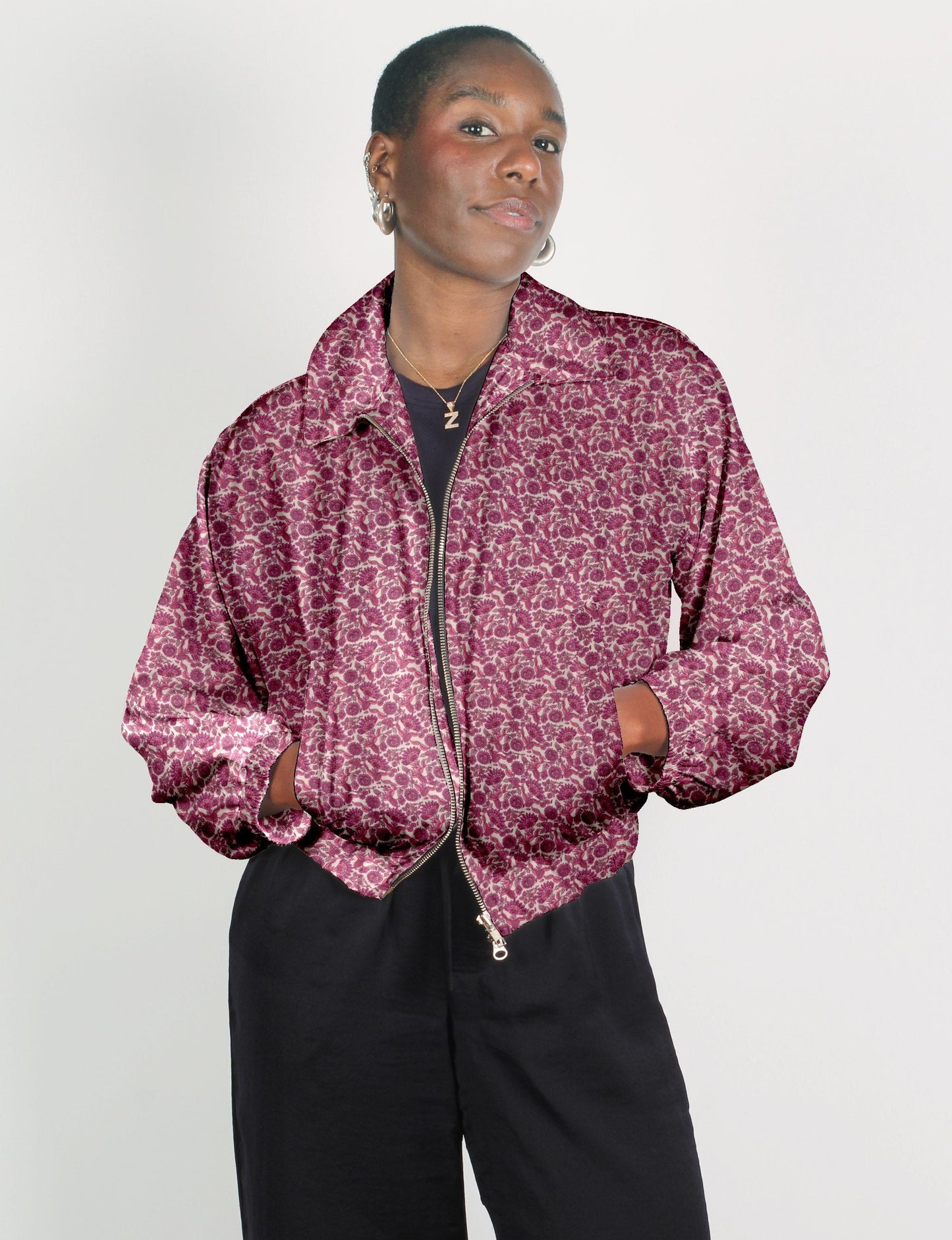 Upcycled Bomber Jacket made from recycled sari materials, featuring a cute cropped shape, elasticated hem and cuffs, and contrast sari print lining. Sustainable apparel promoting eco-friendly fashion and ethical clothing.