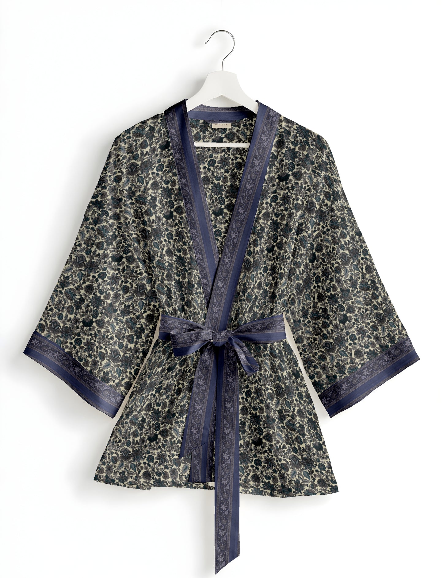 Short kimono robe with wrap front, V-neckline, wide sleeves, waist tie, and concealed skort detail.