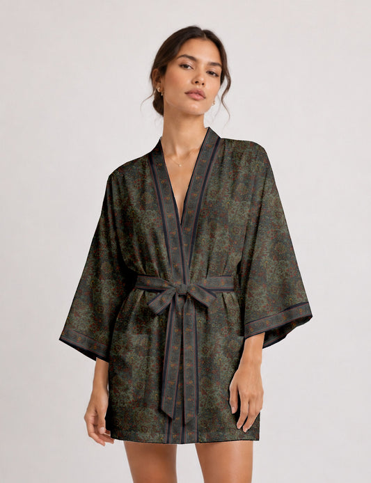 Short kimono robe with wrap front, V-neckline, wide sleeves, waist tie, and concealed skort detail.