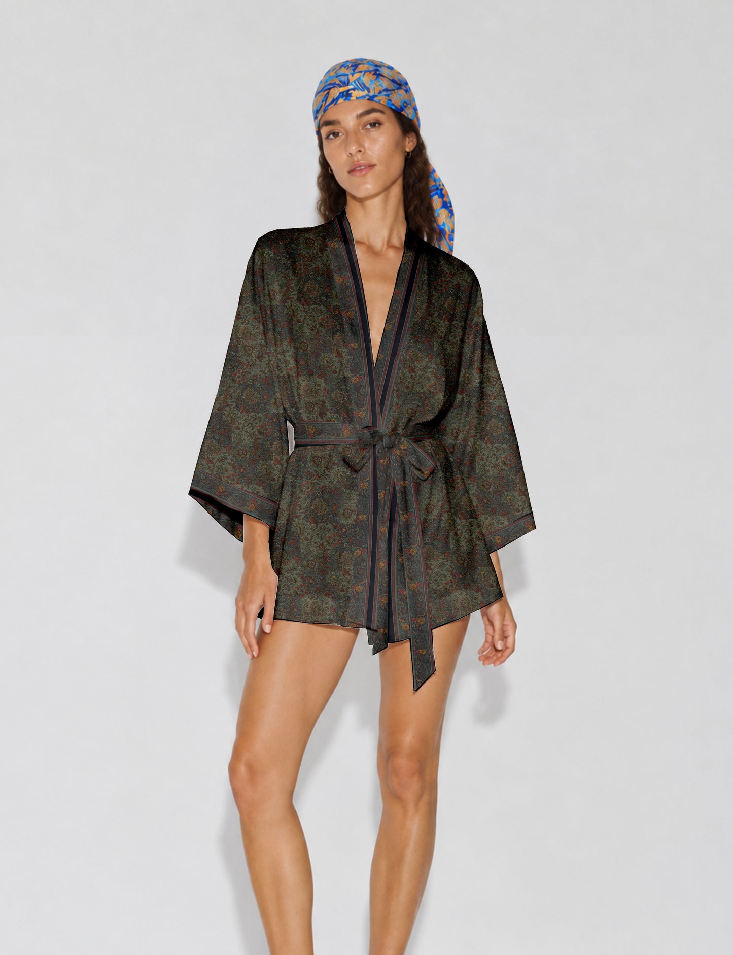 Short kimono robe with wrap front, V-neckline, wide sleeves, waist tie, and concealed skort detail.
