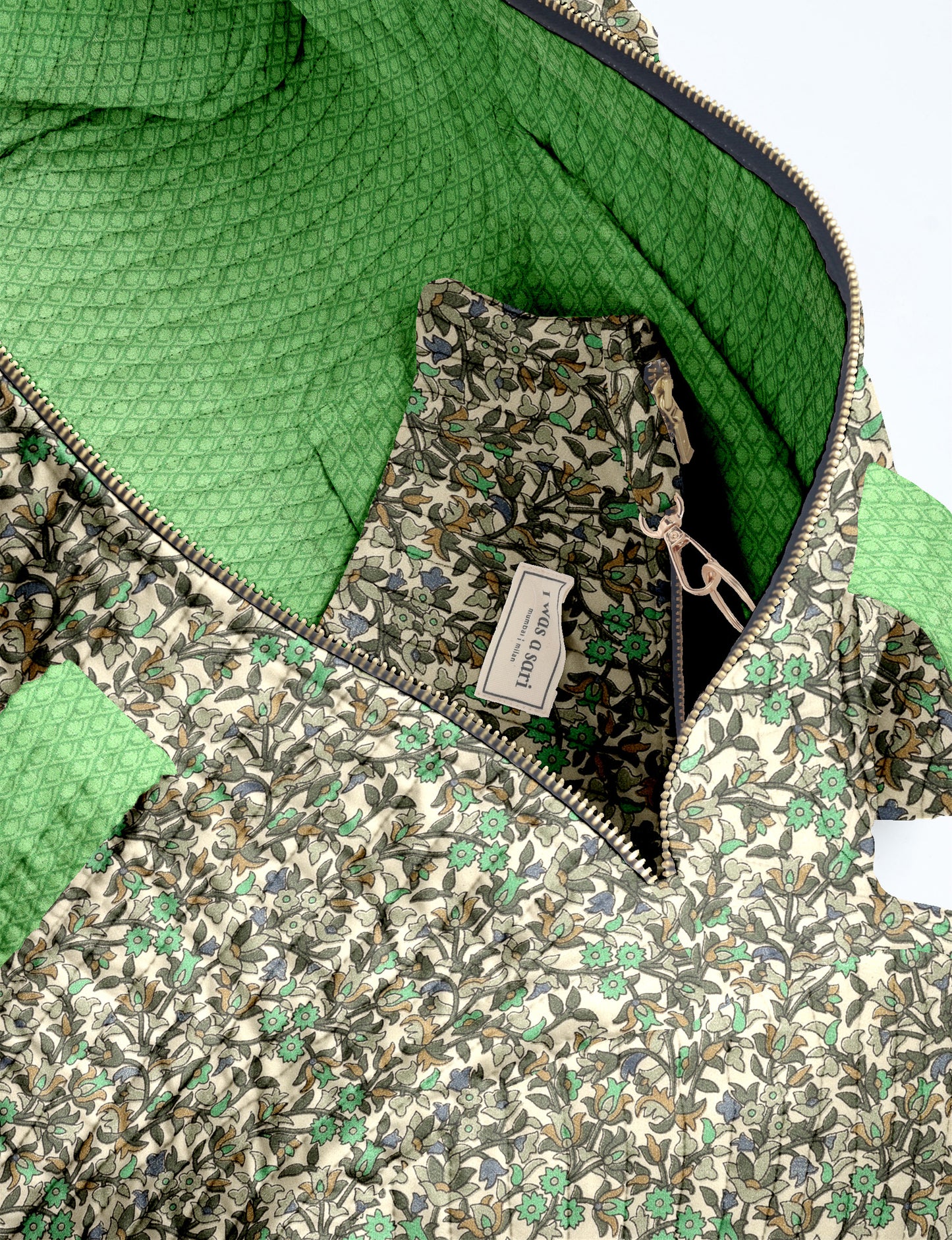 Quilted brown paisley bowling bag with gold zipper, floral interior lining, and interior key clip with label inside pocket