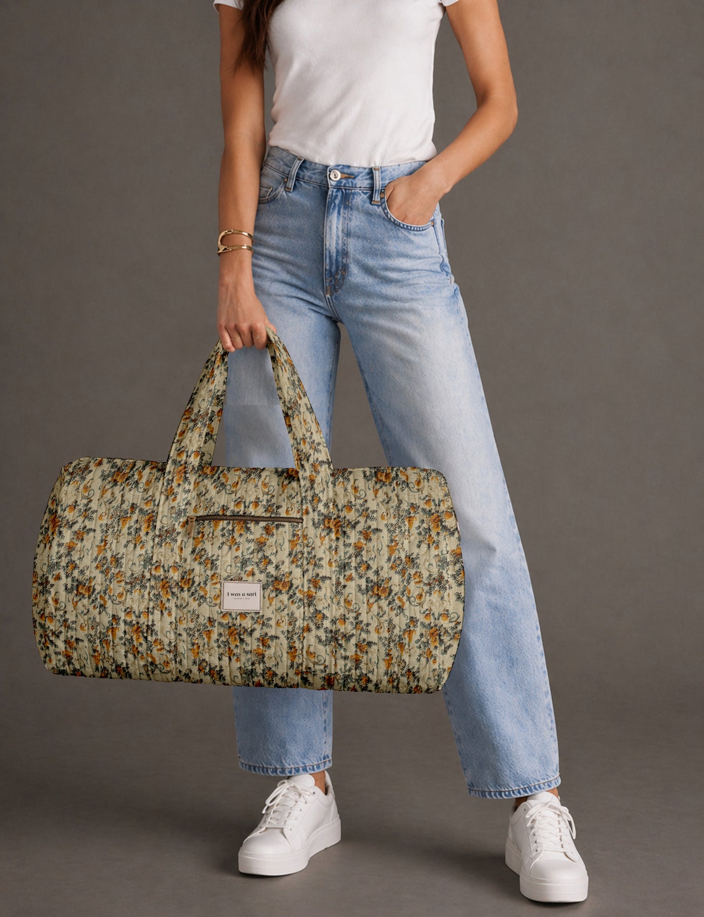 Quilted travel barrel bag with spacious interior and dual handles
Stylish quilted barrel handbag for daily use and short trips
Quilted barrel duffle-style bag with zip closure and inner pouch
I was a Sari quilted barrel bag front view showing structured shape
Quilted barrel bag side view highlighting size and handle drop
Open quilted barrel bag showing spacious interior and pouch