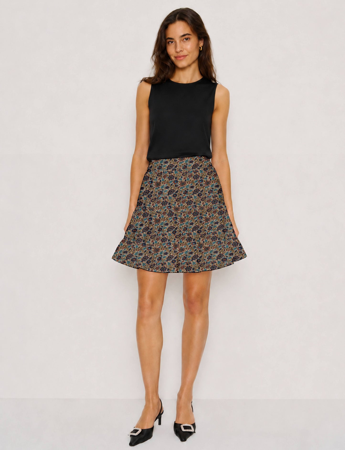 Short tiered skirt with a fitted waistband, knife pleats, softly flared silhouette, side seam pockets, and above-the-knee length.