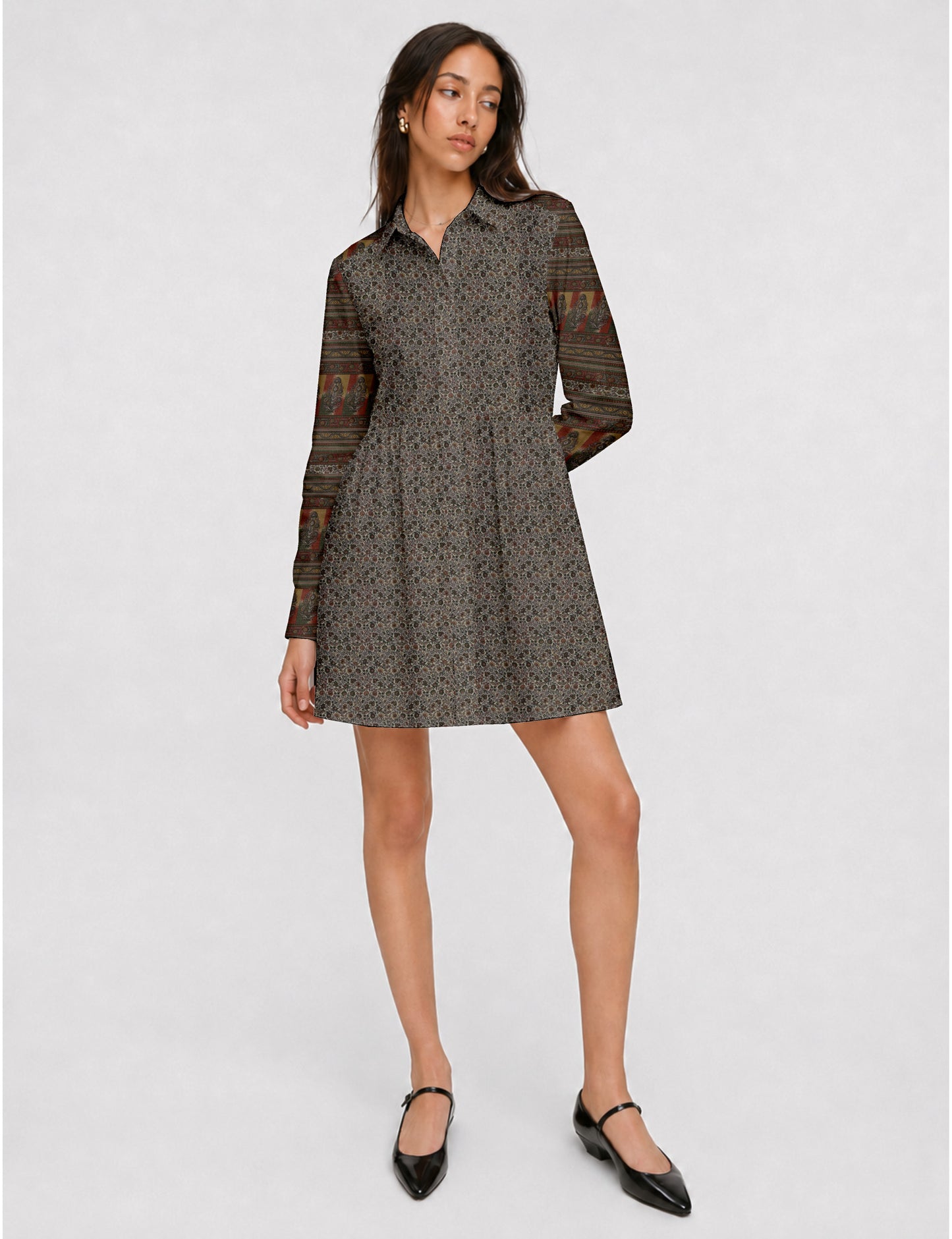 Short shirt dress with a relaxed A-line silhouette, point collar, partial button placket, gathered waist, side pockets, and full-length cuffed sleeves.
