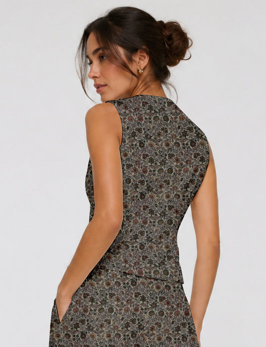 Women's fitted waistcoat with V-neck, single-breasted button closure, tailored silhouette, and pointed hem in sustainable fashion.