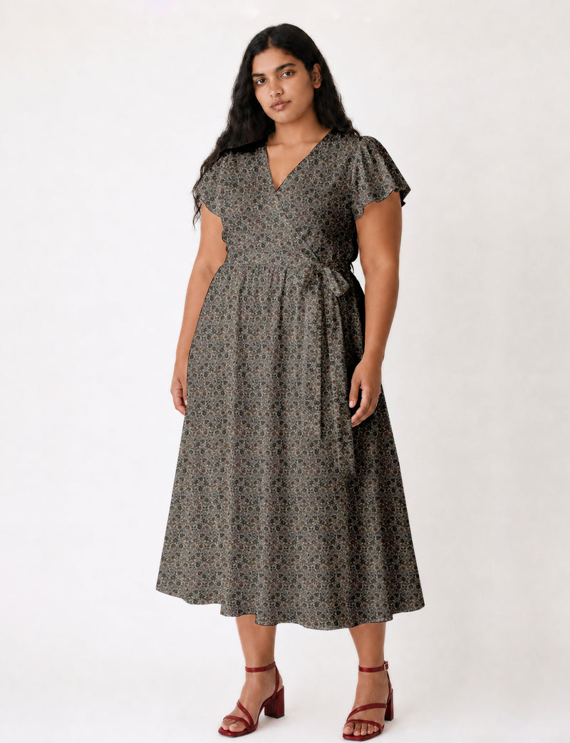Elegant midi wrap dress with a V-neckline, adjustable waist tie, fitted bodice, and flared skirt for a timeless, flattering silhouette.