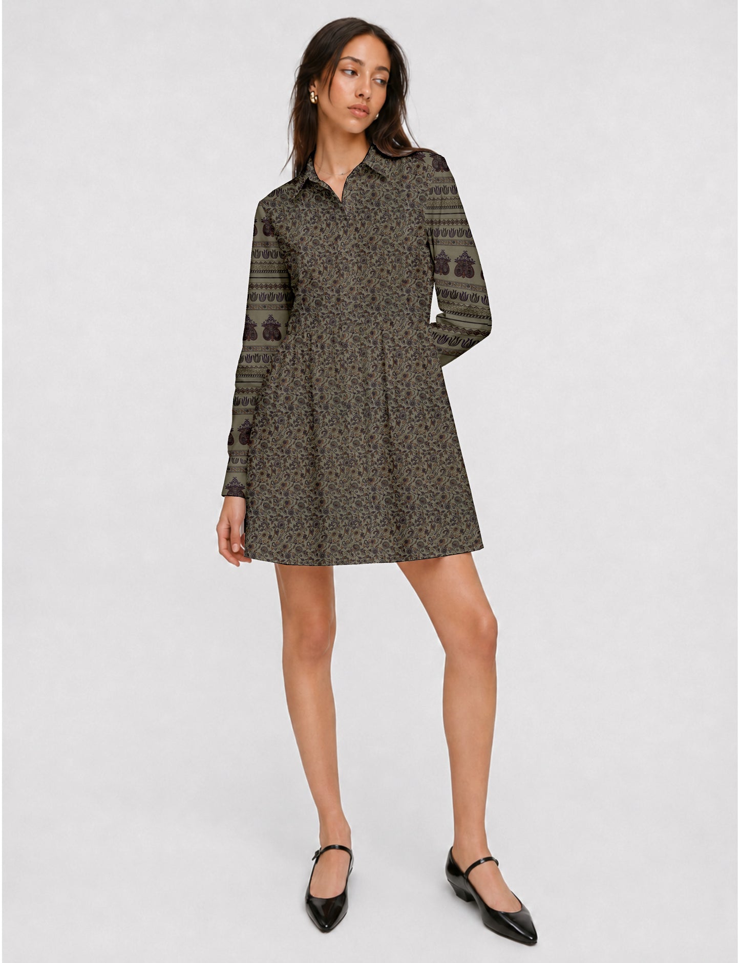 Short shirt dress with a relaxed A-line silhouette, point collar, partial button placket, gathered waist, side pockets, and full-length cuffed sleeves.