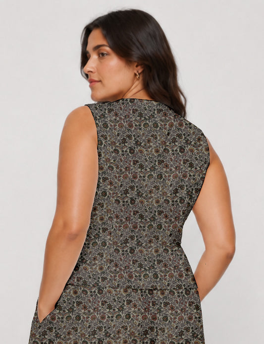 Women's fitted waistcoat with V-neck, single-breasted button closure, tailored silhouette, and pointed hem in sustainable fashion.