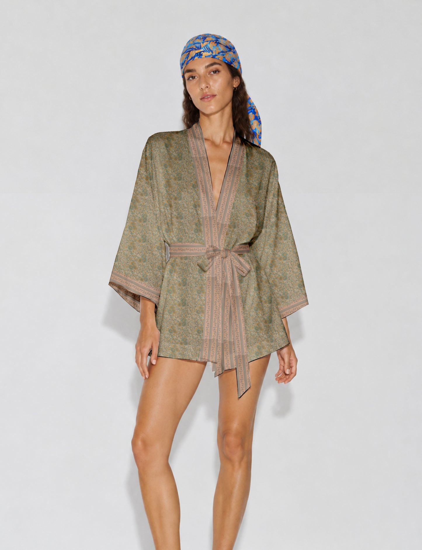 Short kimono robe with wrap front, V-neckline, wide sleeves, waist tie, and concealed skort detail.