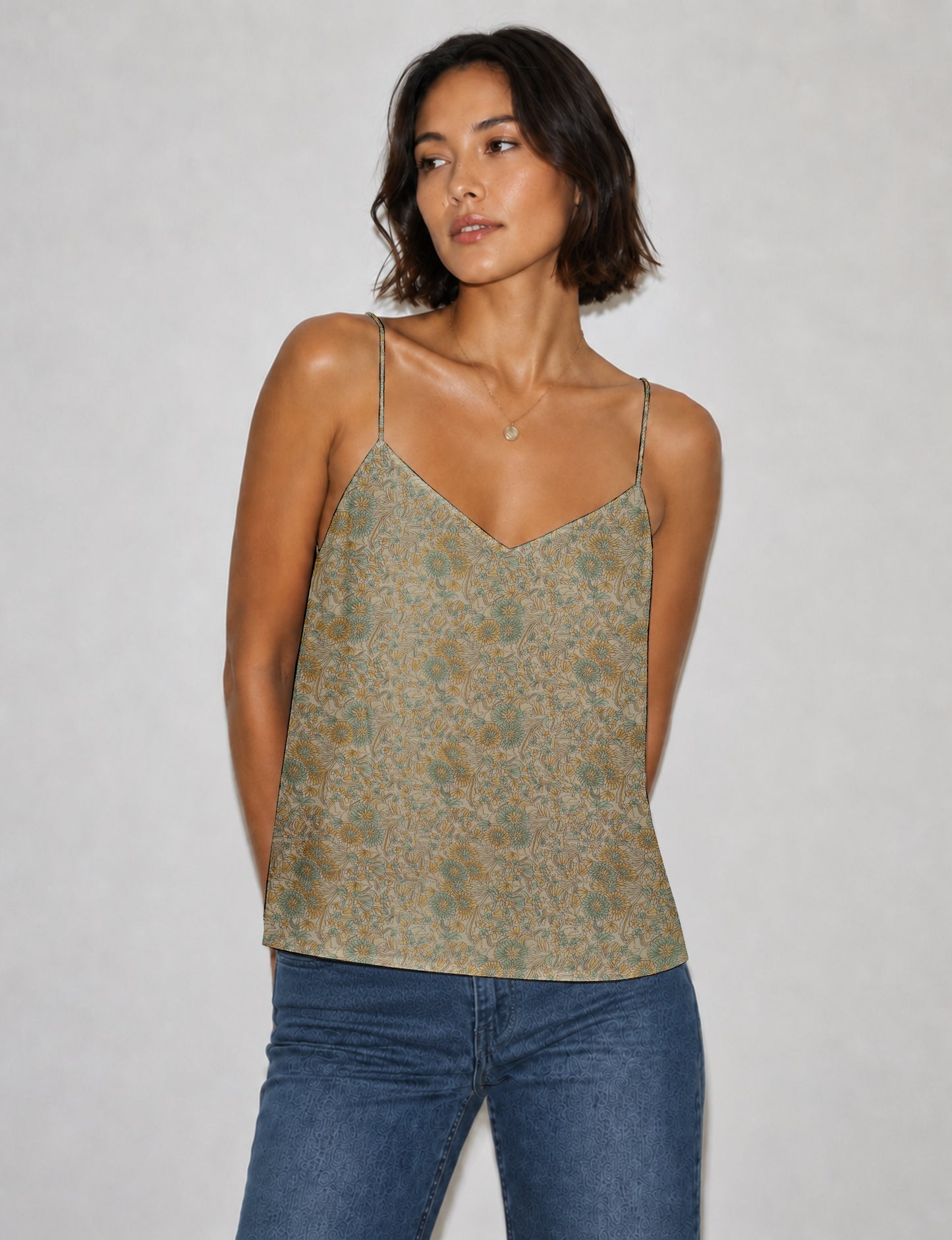 Women's sleeveless slip top with a relaxed straight fit, soft V-neckline, deep V-back, and delicate spaghetti straps.