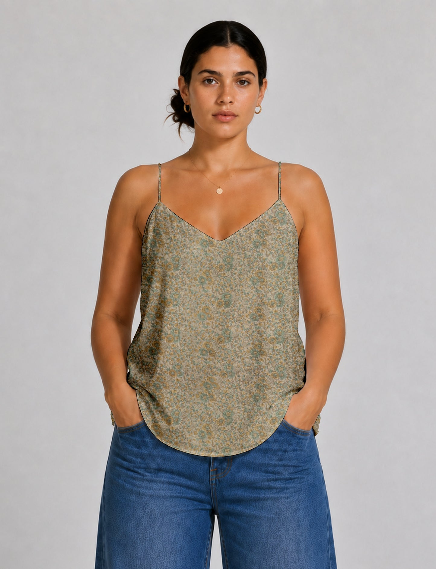 Women's sleeveless slip top with a relaxed straight fit, soft V-neckline, deep V-back, and delicate spaghetti straps.
