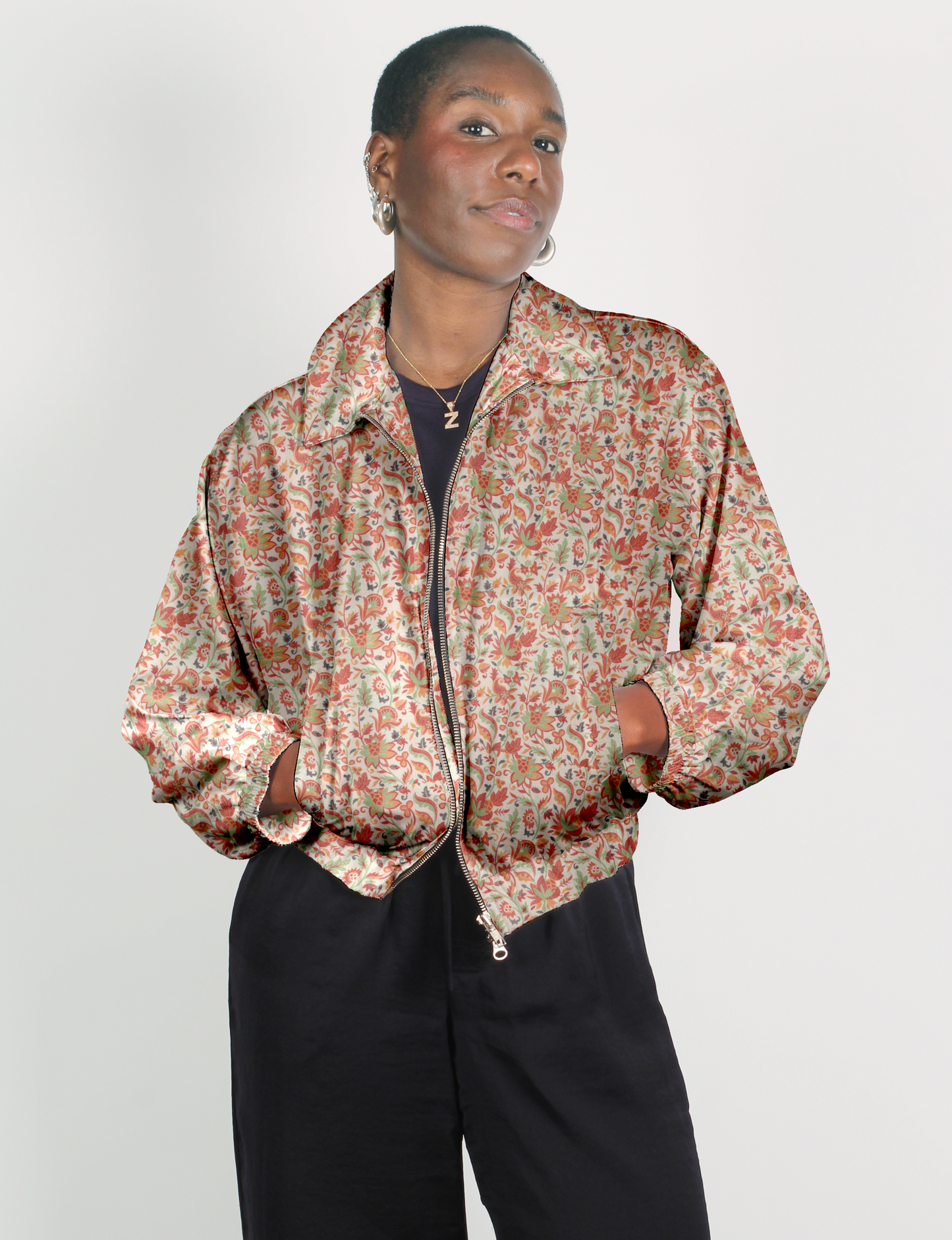 Upcycled Bomber Jacket made from recycled sari materials, featuring a cute cropped shape, elasticated hem and cuffs, and contrast sari print lining. Sustainable apparel promoting eco-friendly fashion and ethical clothing.