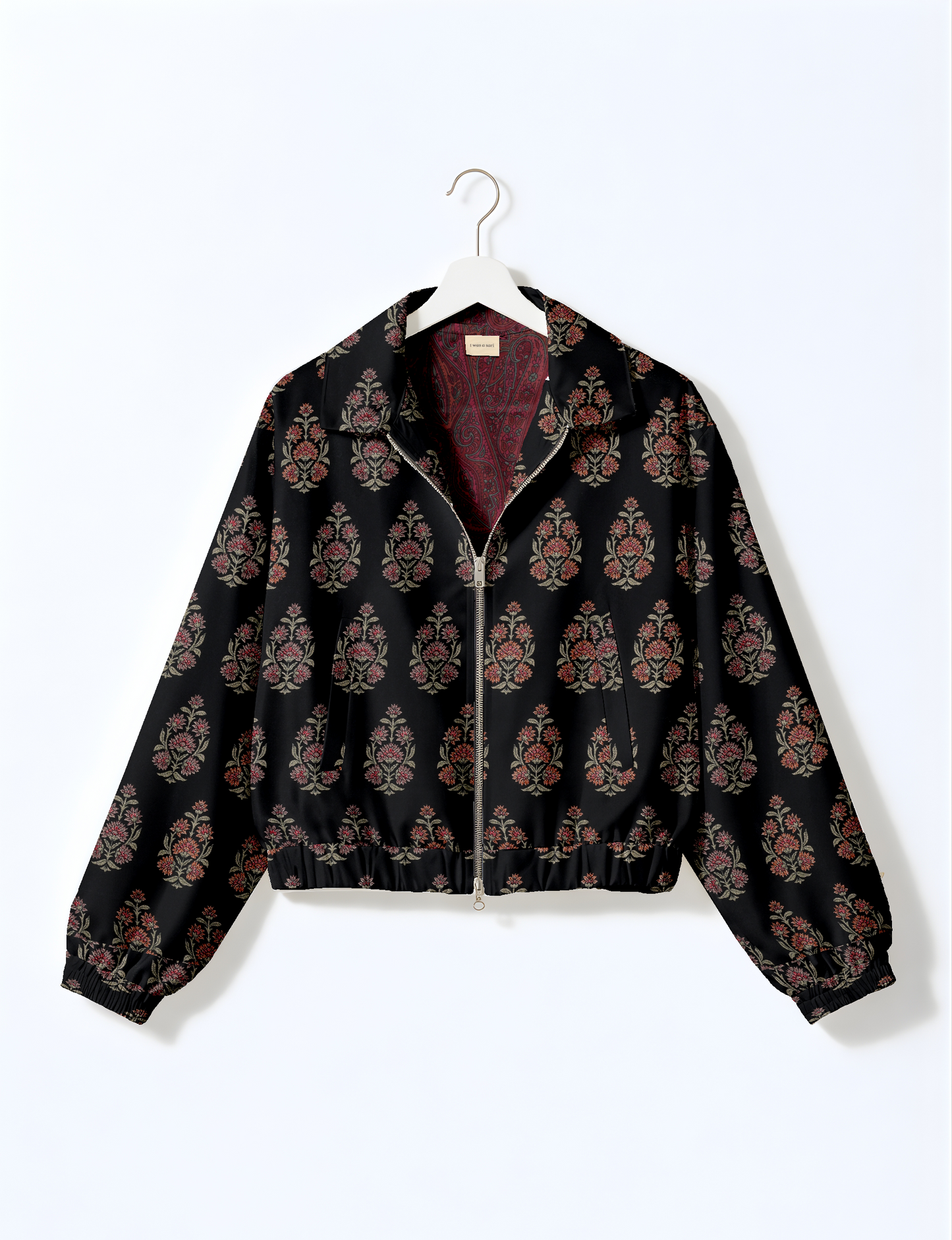 Upcycled Bomber Jacket made from recycled sari materials, featuring a cute cropped shape, elasticated hem and cuffs, and contrast sari print lining. Sustainable apparel promoting eco-friendly fashion and ethical clothing.