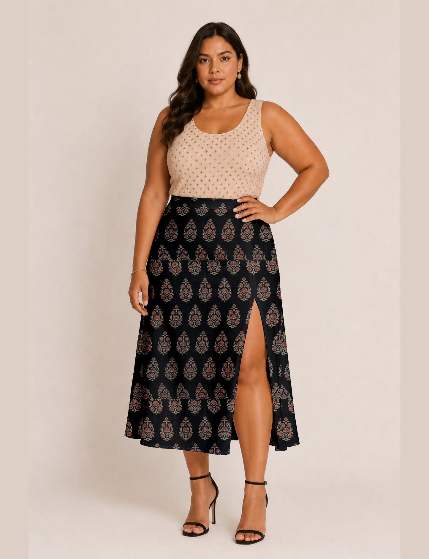Midi A-line skirt with front slit, fitted waistband, concealed side closure, and below mid-calf length silhouette.