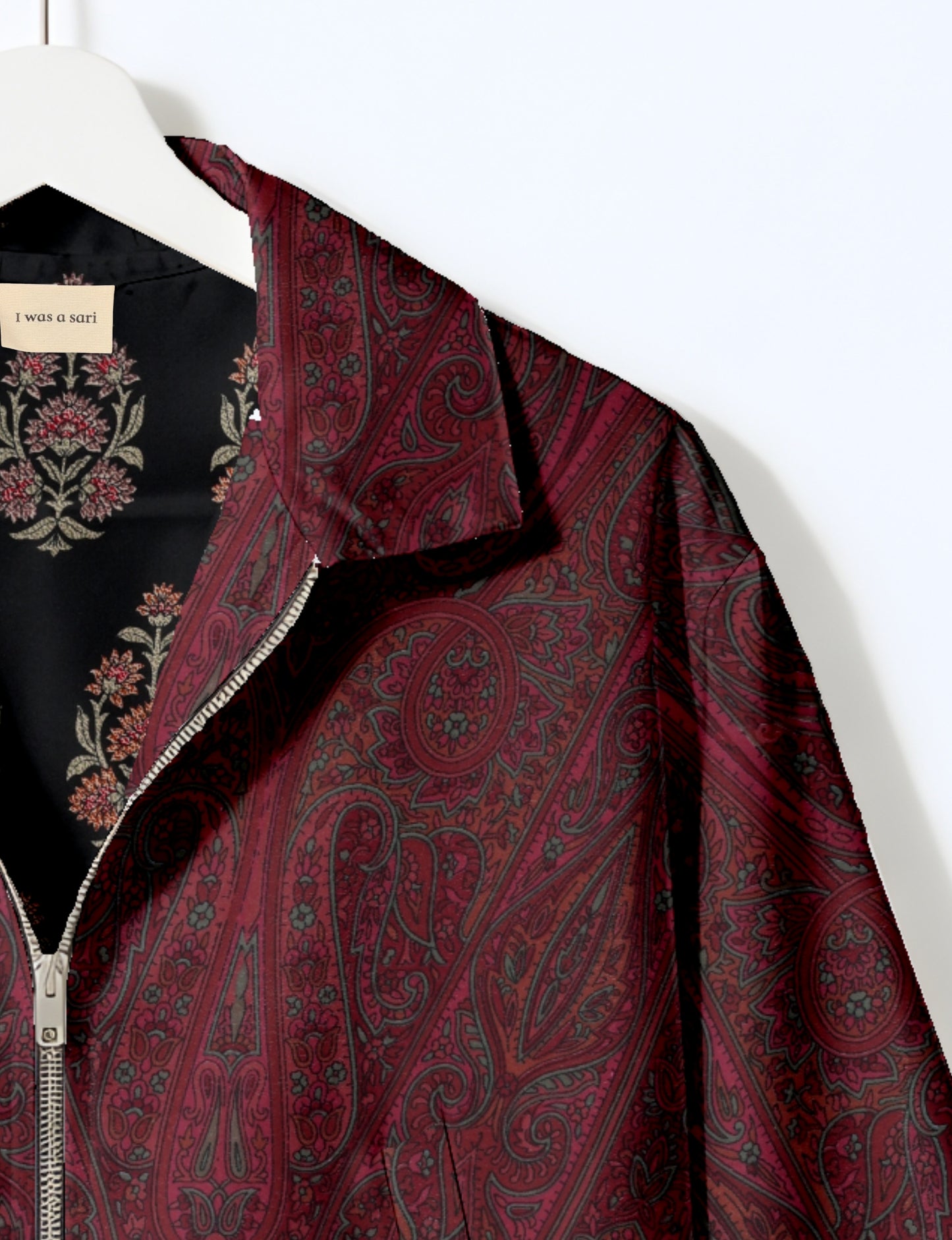 Upcycled Bomber Jacket made from recycled sari materials, featuring a cute cropped shape, elasticated hem and cuffs, and contrast sari print lining. Sustainable apparel promoting eco-friendly fashion and ethical clothing.