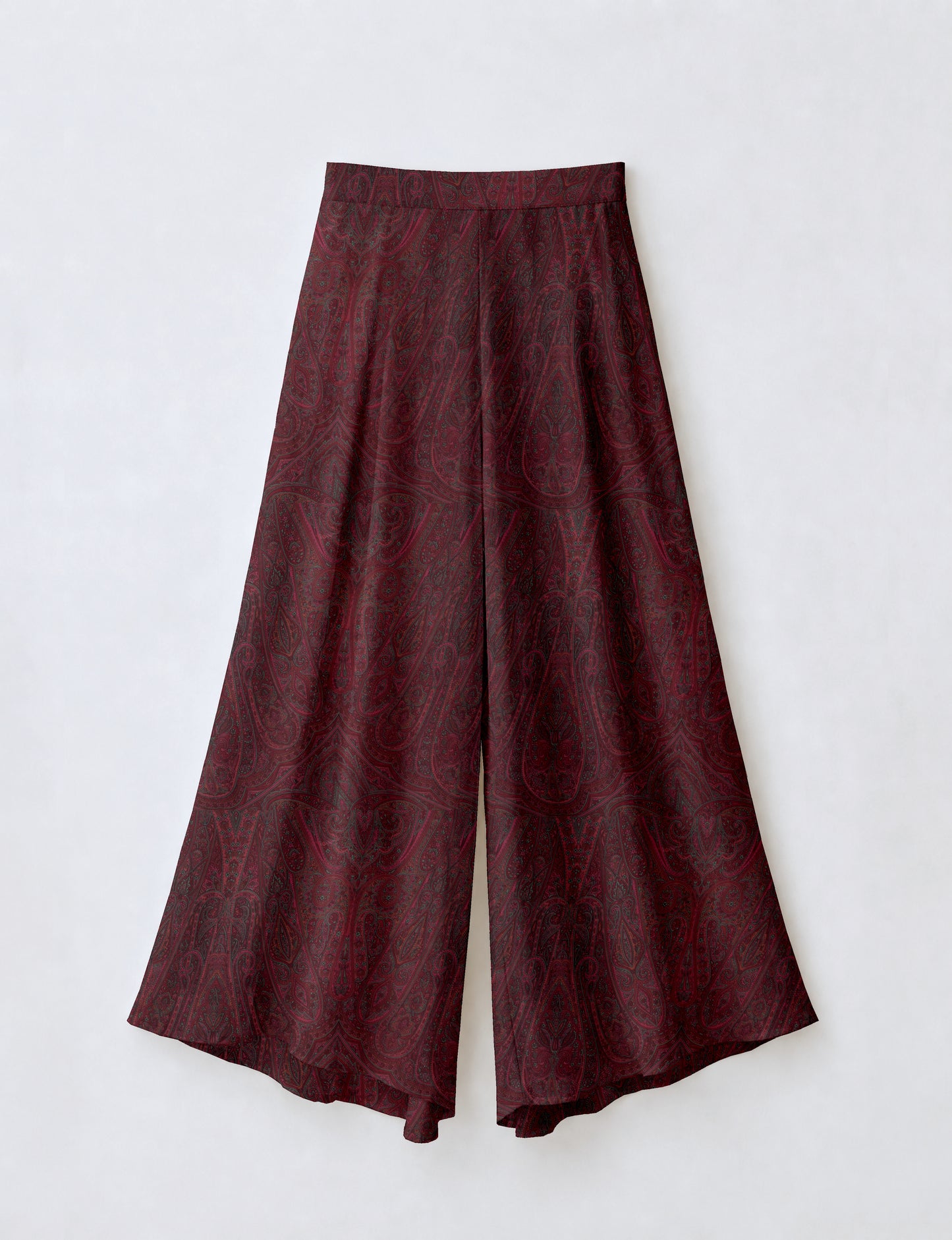 Women's wide leg palazzo trousers with a fitted waistband and relaxed flowing silhouette.