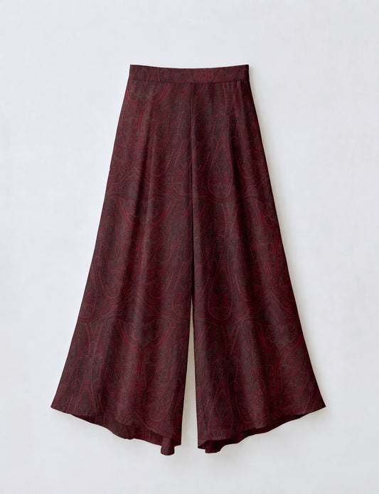 Women's wide leg palazzo trousers with a fitted waistband and relaxed flowing silhouette.