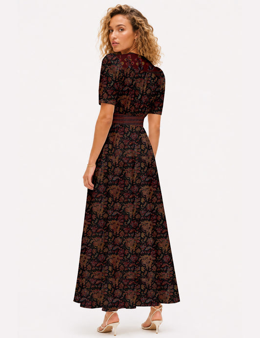 Maxi romantic dress with a fitted bodice, V-neckline, functional button placket, structured waist panel, short sleeves, and a softly flared ankle-length A-line skirt.