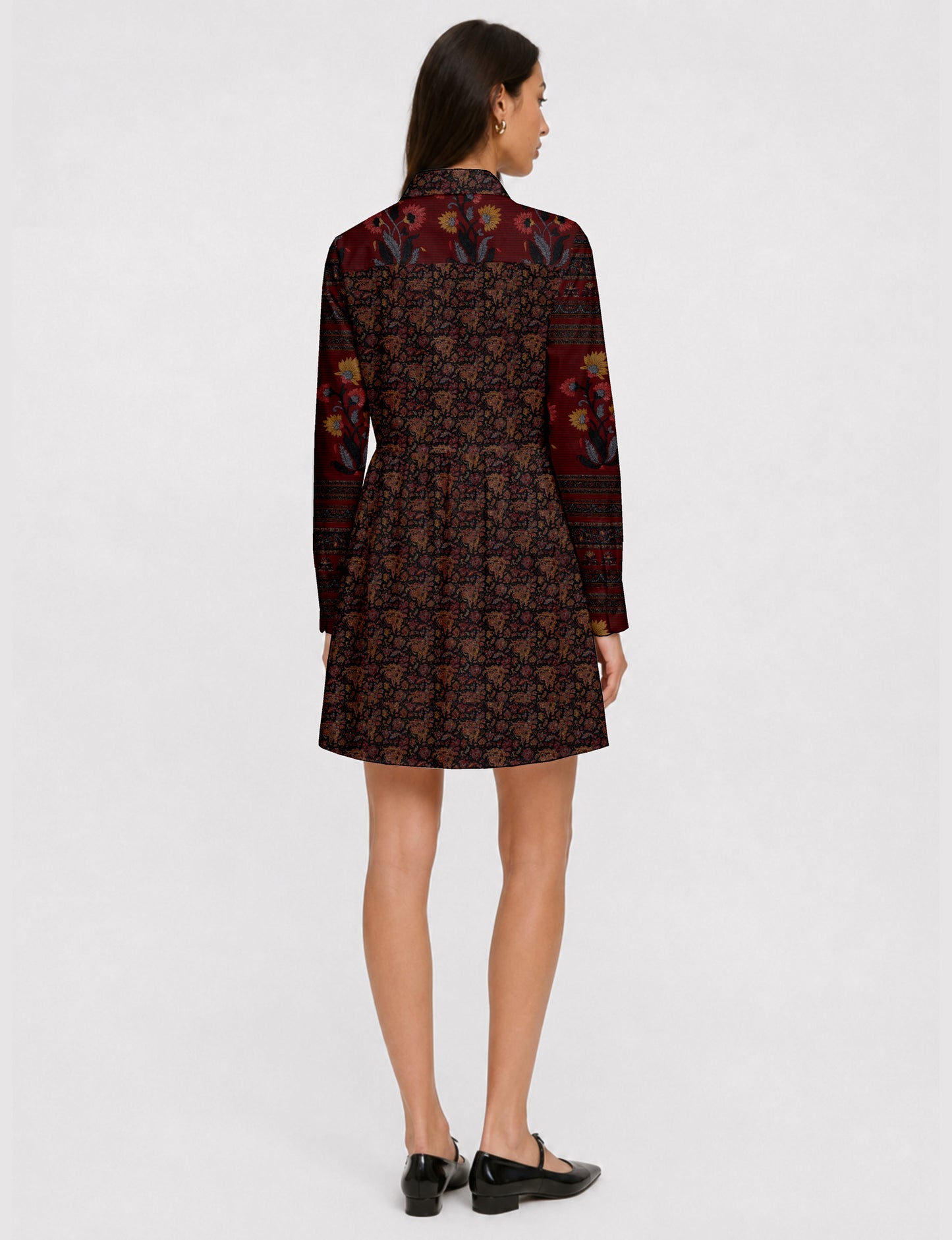 Short shirt dress with a relaxed A-line silhouette, point collar, partial button placket, gathered waist, side pockets, and full-length cuffed sleeves.