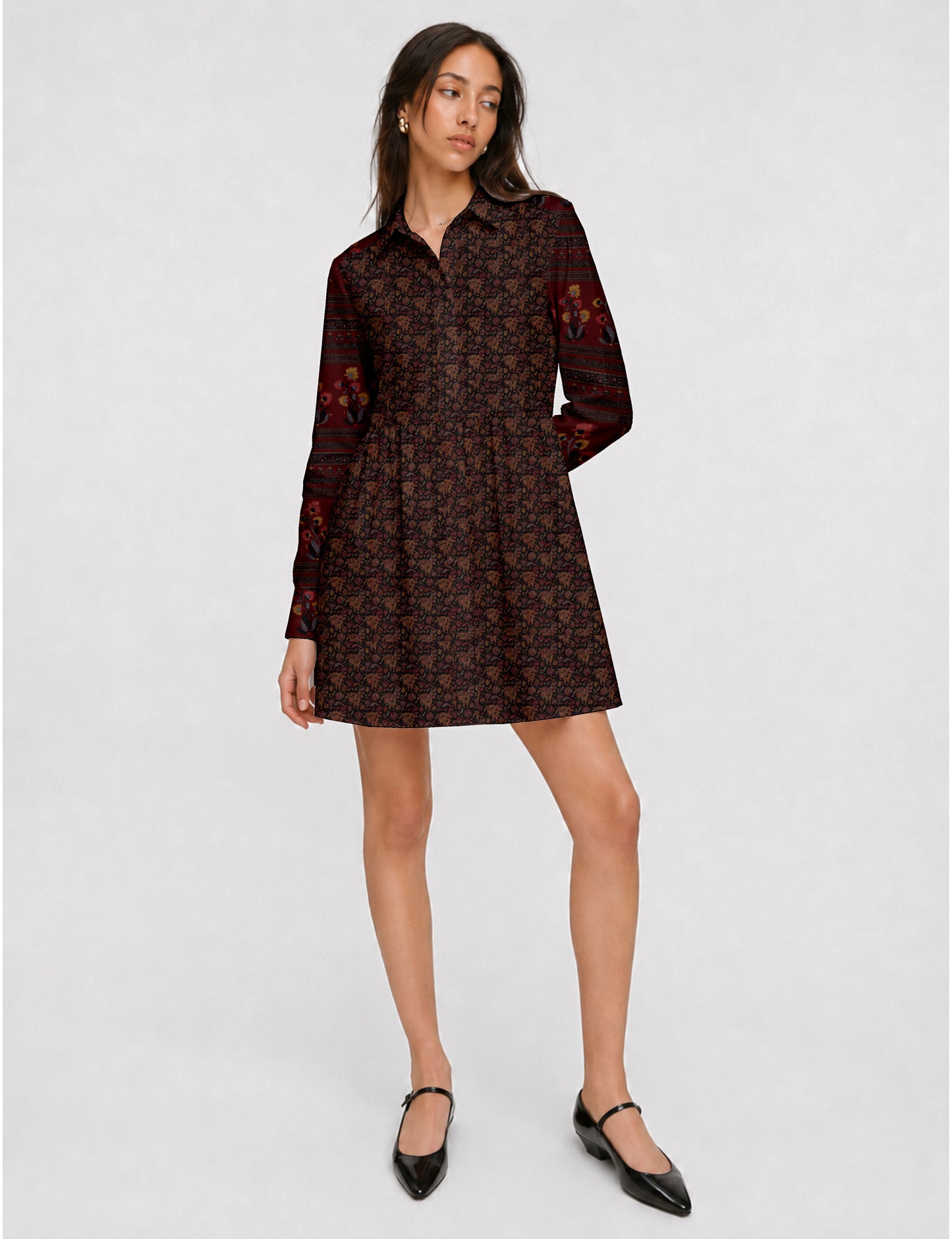 Short shirt dress with a relaxed A-line silhouette, point collar, partial button placket, gathered waist, side pockets, and full-length cuffed sleeves.