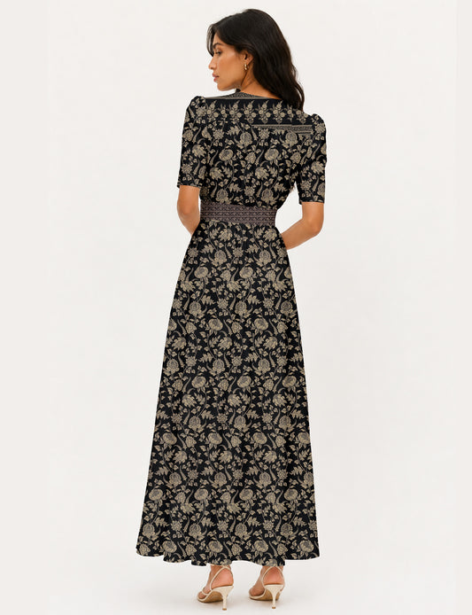 Maxi romantic dress with a fitted bodice, V-neckline, functional button placket, structured waist panel, short sleeves, and a softly flared ankle-length A-line skirt.