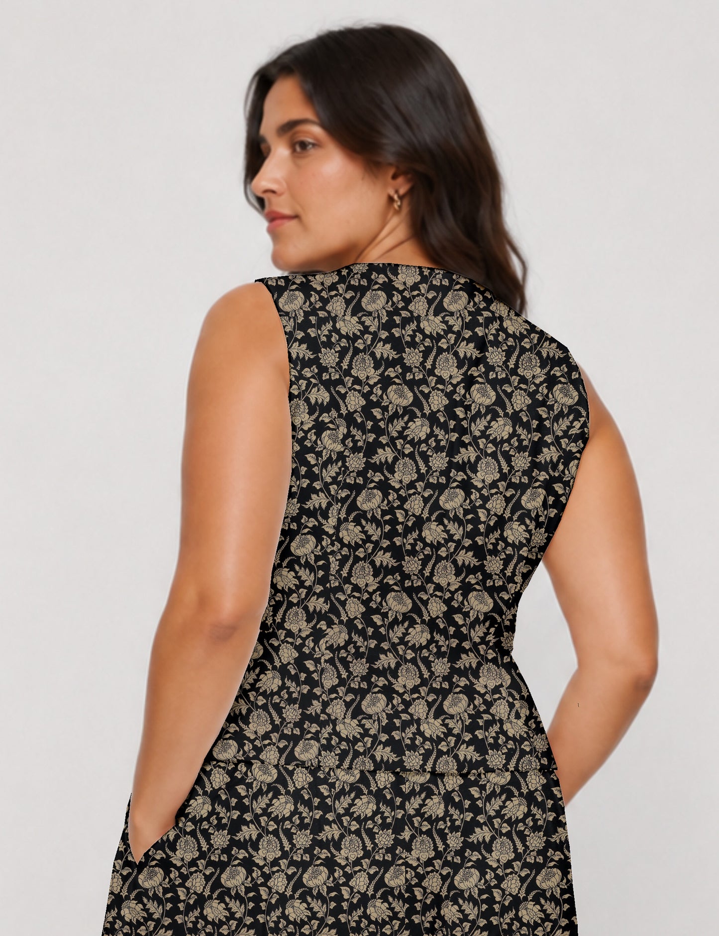 Women's fitted waistcoat with V-neck, single-breasted button closure, tailored silhouette, and pointed hem in sustainable fashion.