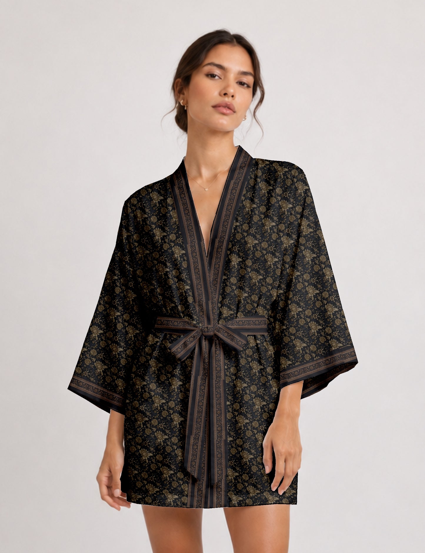 Short kimono robe with wrap front, V-neckline, wide sleeves, waist tie, and concealed skort detail.