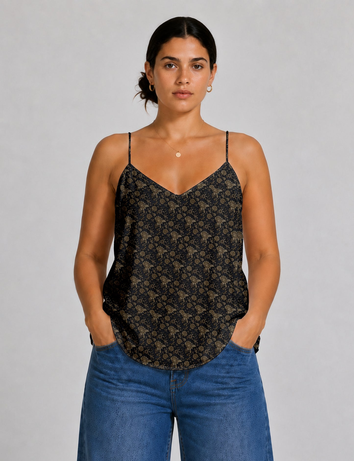 Women's sleeveless slip top with a relaxed straight fit, soft V-neckline, deep V-back, and delicate spaghetti straps.