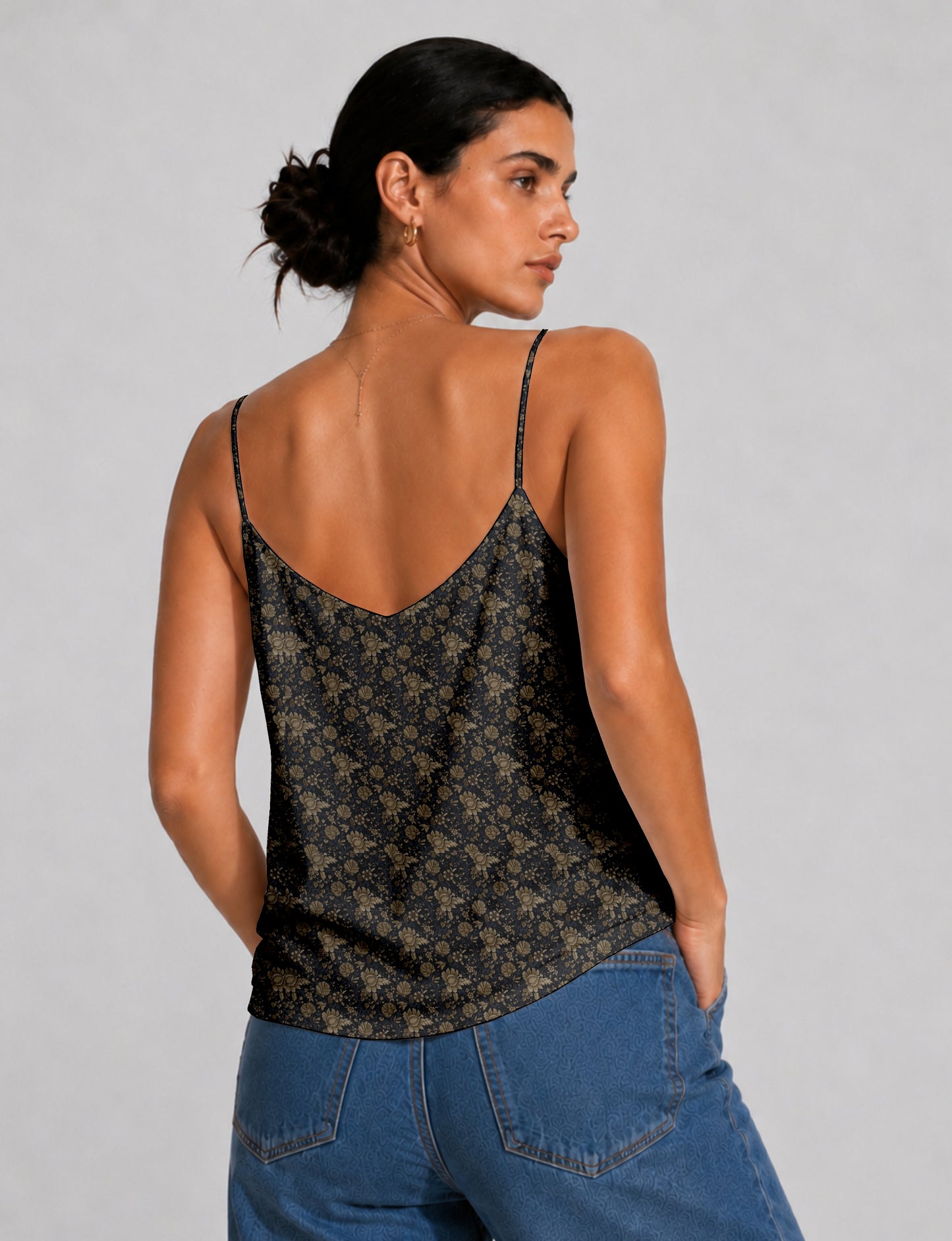 Women's sleeveless slip top with a relaxed straight fit, soft V-neckline, deep V-back, and delicate spaghetti straps.