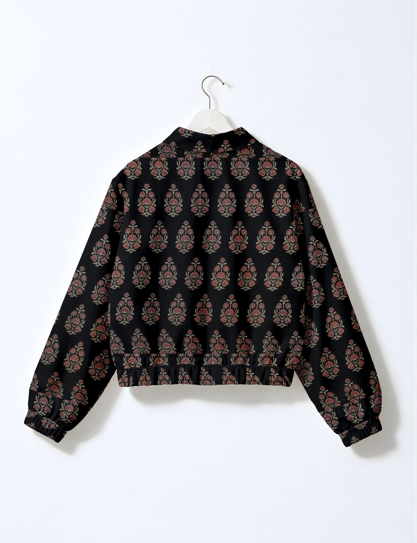 Women's cropped bomber jacket with twin metallic front zippers, welt pockets, elasticated hem and cuffs, and contrast sari print lining.