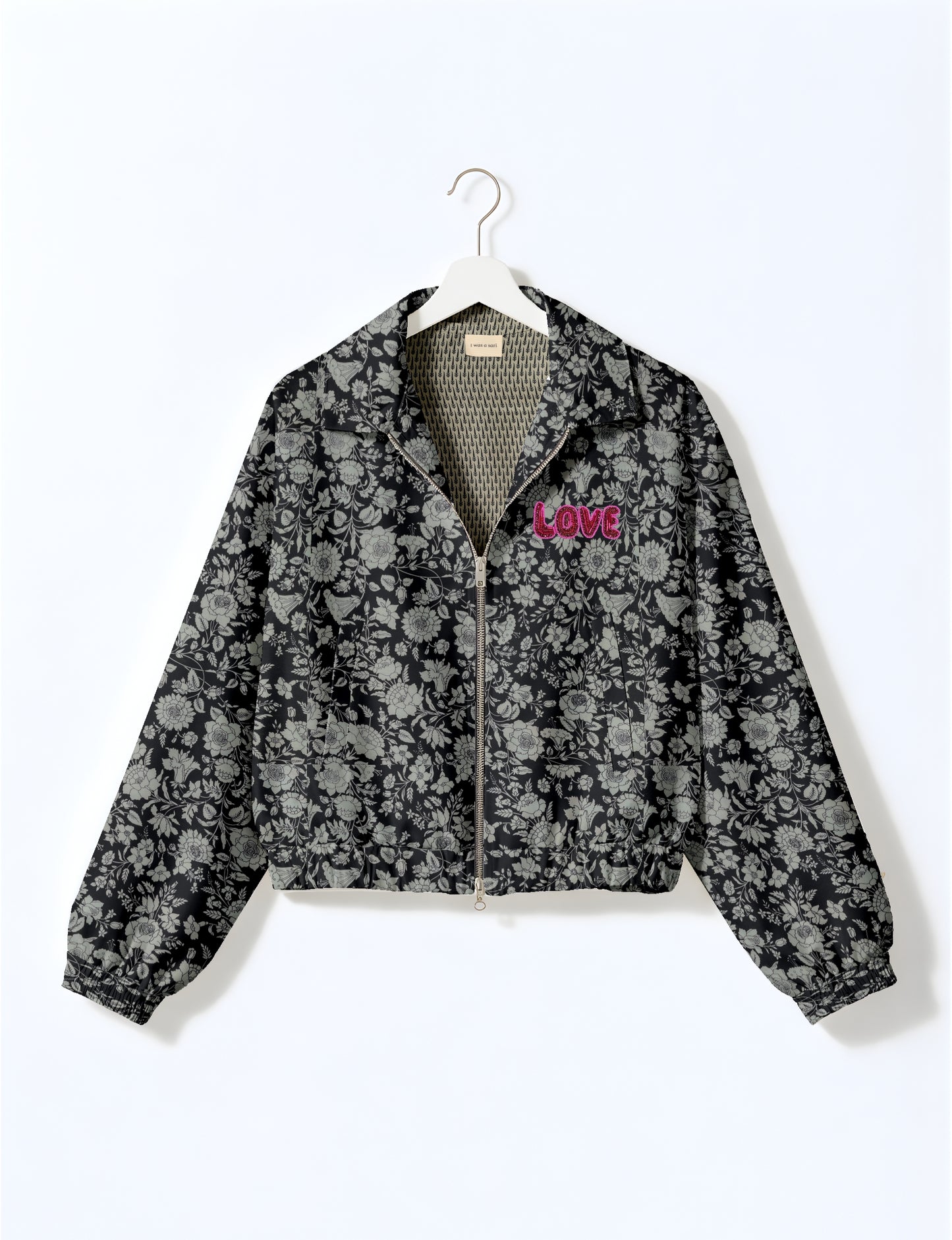 Love Bomber Jacket made from recycled fabric, featuring hand-stitched Aari embroidery. A unique piece of zero-waste clothing, part of the circular fashion movement. Designed with upcycled materials for a stylish yet environmentally friendly clothing choice.