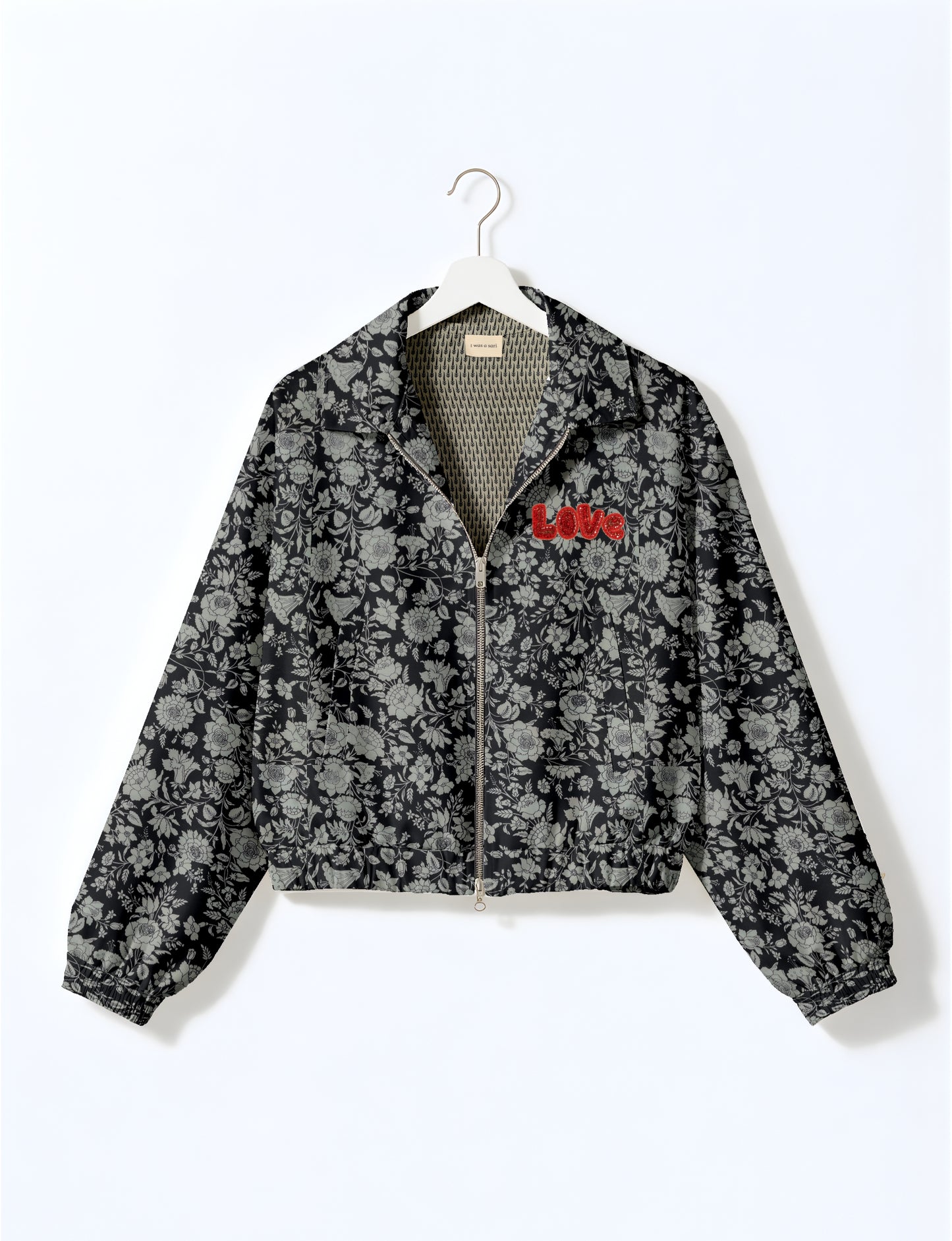 Love Bomber Jacket made from recycled fabric, featuring hand-stitched Aari embroidery. A unique piece of zero-waste clothing, part of the circular fashion movement. Designed with upcycled materials for a stylish yet environmentally friendly clothing choice.