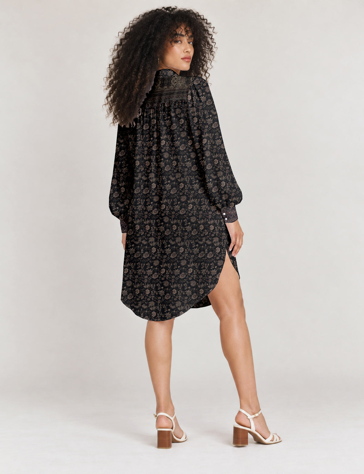 High low shirt with a relaxed fit, button-down front, classic collar, gathered shoulders and full-length blouson sleeves.