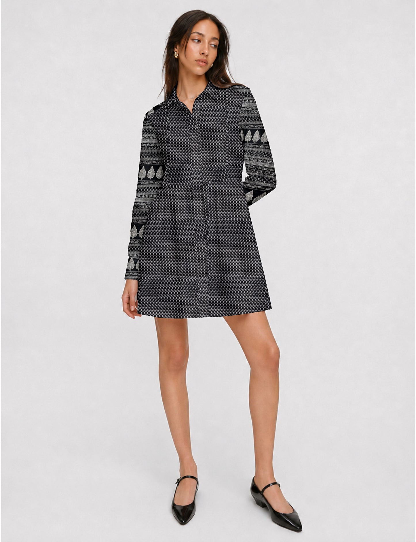 Short shirt dress with a relaxed A-line silhouette, point collar, partial button placket, gathered waist, side pockets, and full-length cuffed sleeves.