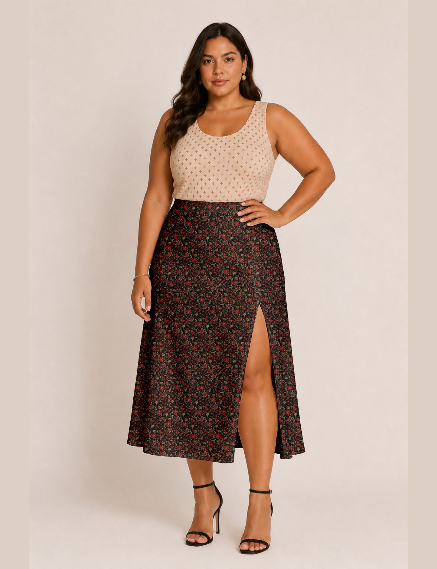 Woman wearing a yellow and black micro patterned A-line skirt with front slit, paired with beige sleeveless top and black