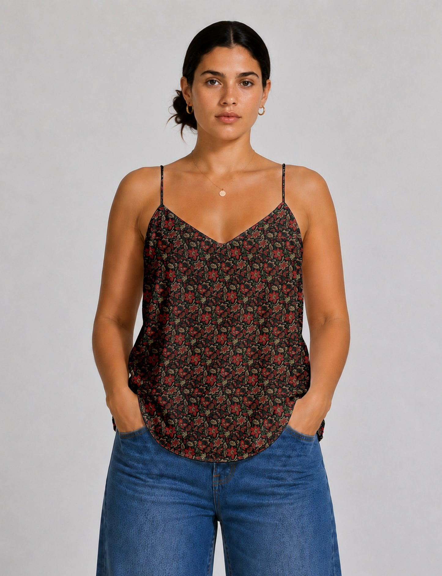 Women's sleeveless slip top with a relaxed straight fit, soft V-neckline, deep V-back, and delicate spaghetti straps.