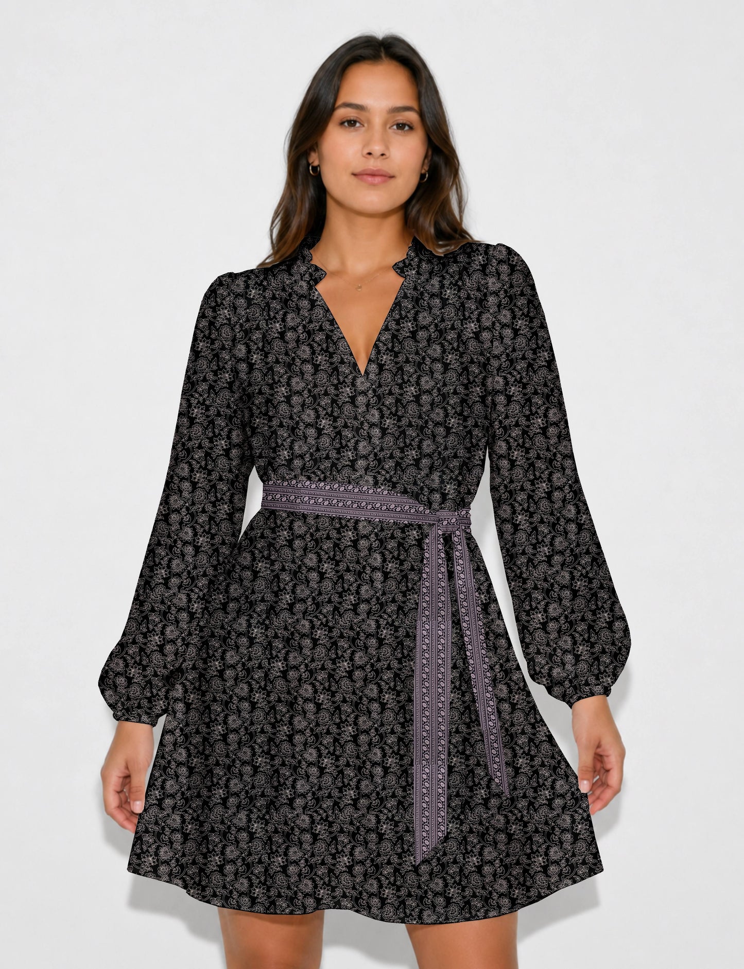 Swing dress with detachable tie belt, gathered ruffle neckline, full-length voluminous sleeves, elastic cuffs, and relaxed A-line silhouette in an above-knee length.