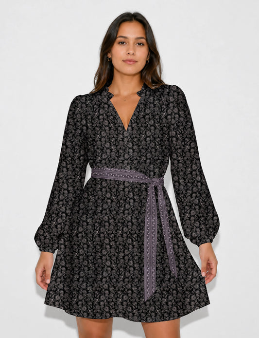 Swing dress with detachable tie belt, gathered ruffle neckline, full-length voluminous sleeves, elastic cuffs, and relaxed A-line silhouette in an above-knee length.