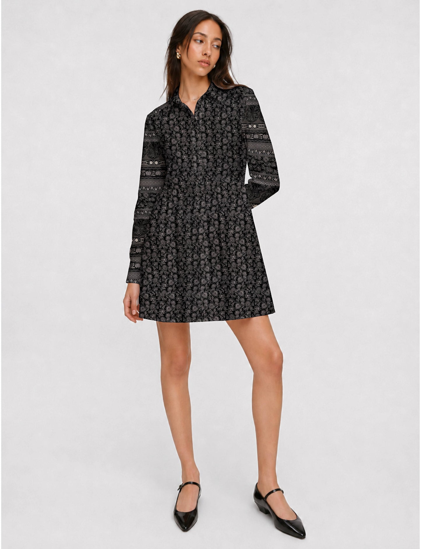 Short shirt dress with a relaxed A-line silhouette, point collar, partial button placket, gathered waist, side pockets, and full-length cuffed sleeves.