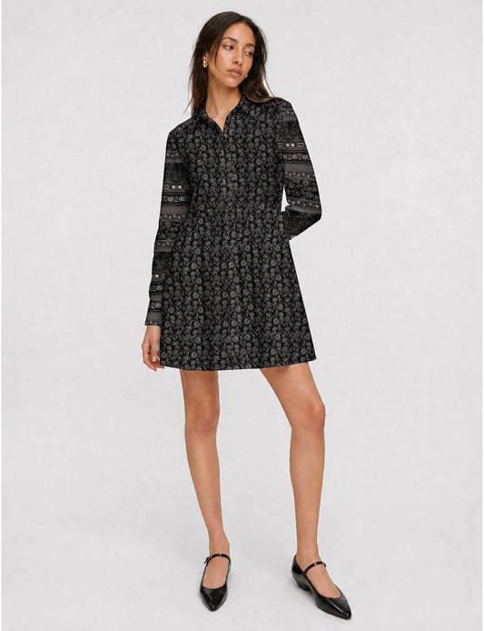 Short shirt dress with a relaxed A-line silhouette, point collar, partial button placket, gathered waist, side pockets, and full-length cuffed sleeves.