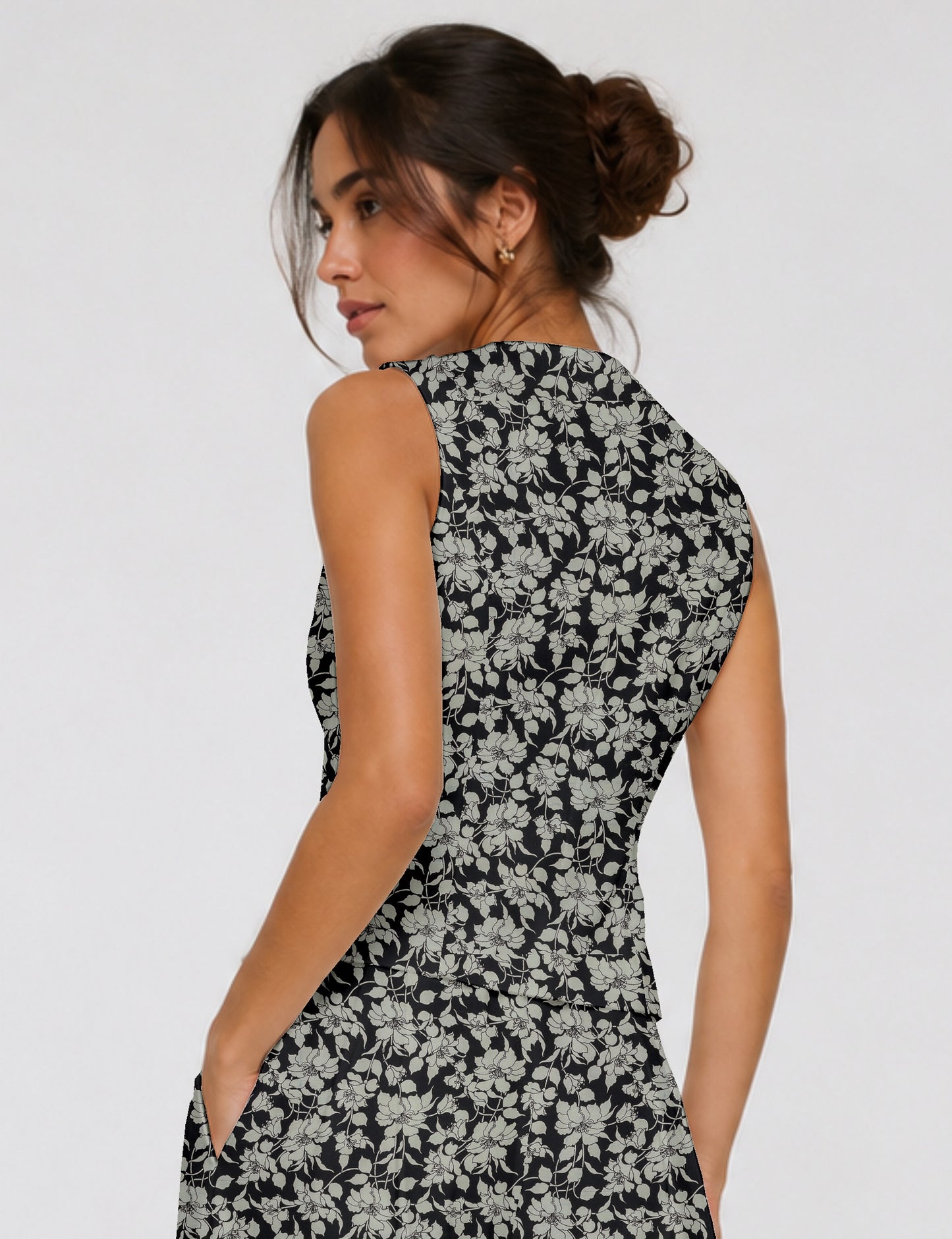 Women's fitted waistcoat with V-neck, single-breasted button closure, tailored silhouette, and pointed hem in sustainable fashion.