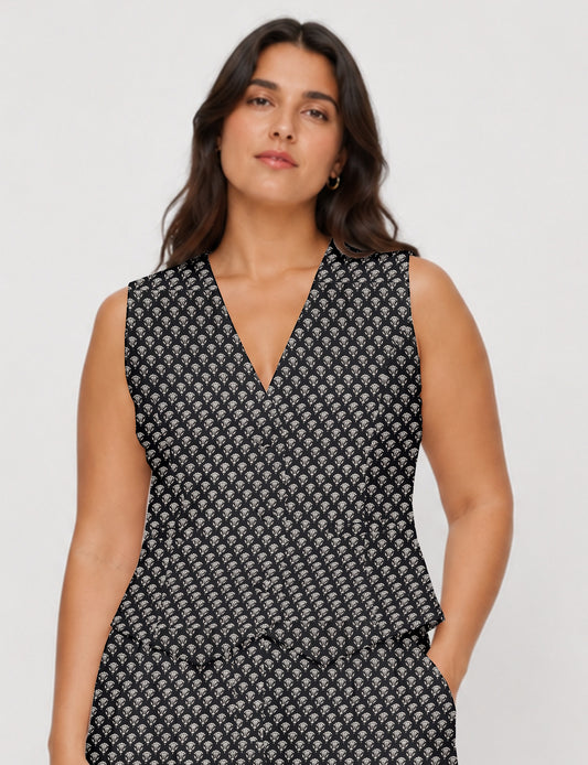 Women's fitted waistcoat with V-neck, single-breasted button closure, tailored silhouette, and pointed hem in sustainable fashion.
