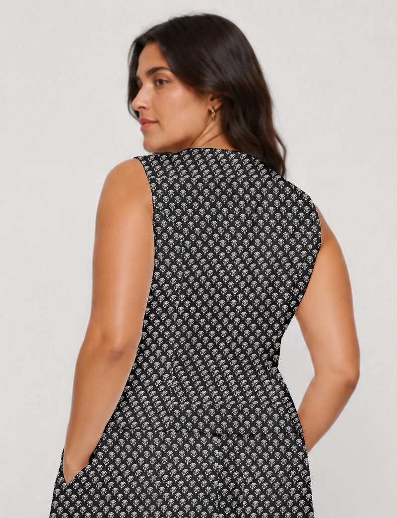 Women's fitted waistcoat with V-neck, single-breasted button closure, tailored silhouette, and pointed hem in sustainable fashion.