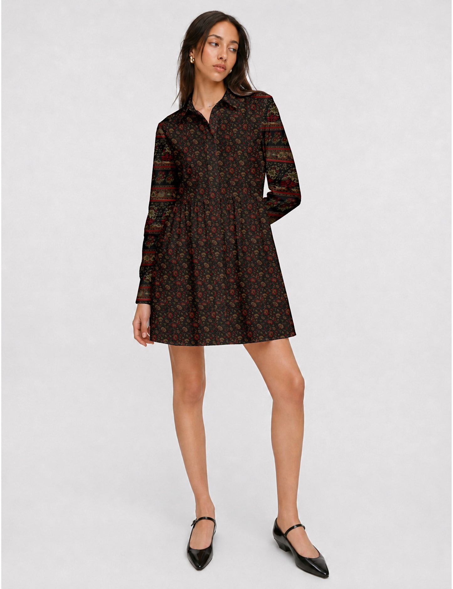 Short shirt dress with a relaxed A-line silhouette, point collar, partial button placket, gathered waist, side pockets, and full-length cuffed sleeves.
