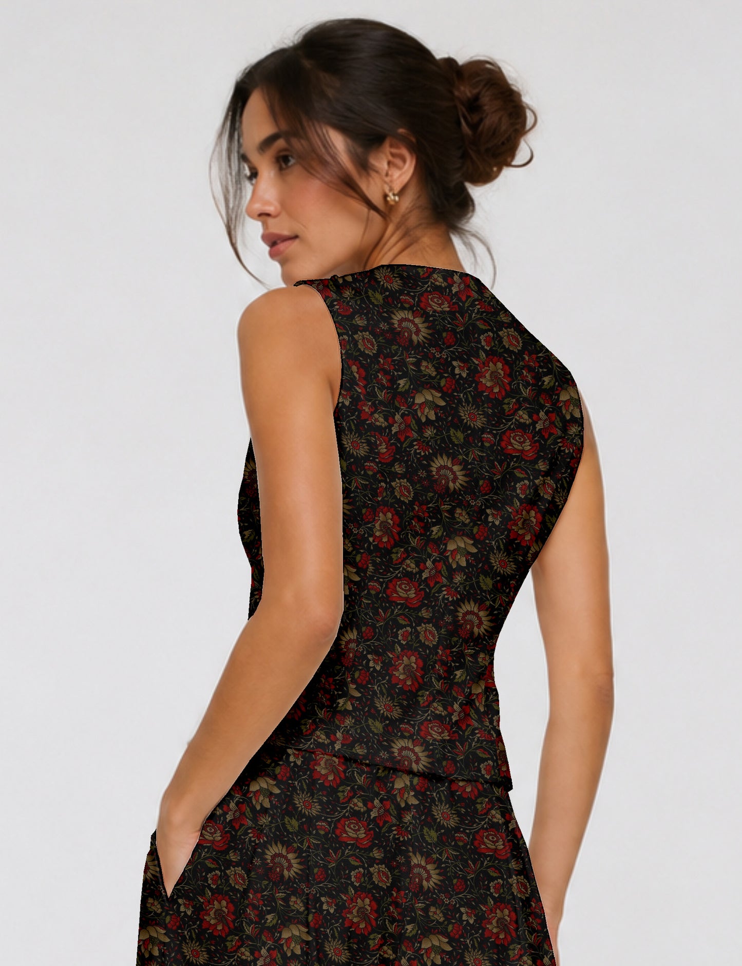 Women's fitted waistcoat with V-neck, single-breasted button closure, tailored silhouette, and pointed hem in sustainable fashion.