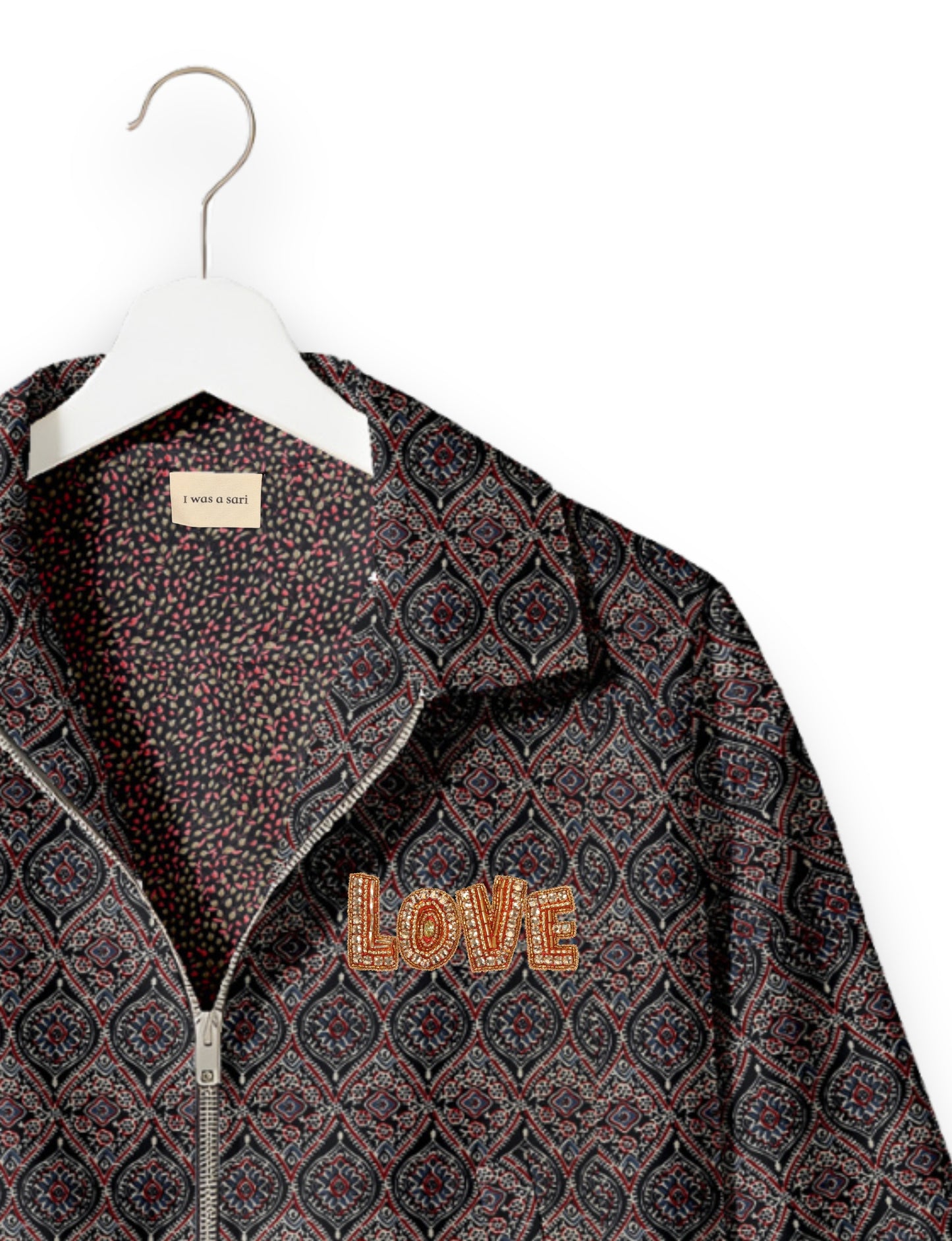 Love Bomber Jacket made from recycled fabric, featuring hand-stitched Aari embroidery. A unique piece of zero-waste clothing, part of the circular fashion movement. Designed with upcycled materials for a stylish yet environmentally friendly clothing choice.